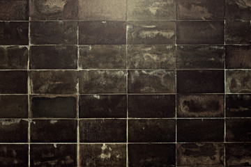 Naklejka premium The wall is finished with marble tiles, the texture of the marble facade of the building, the surface of the old marble blocks