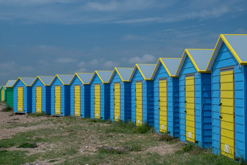 Naklejka premium Row of brightly coloured Beach Huts Littlehampton Seafront