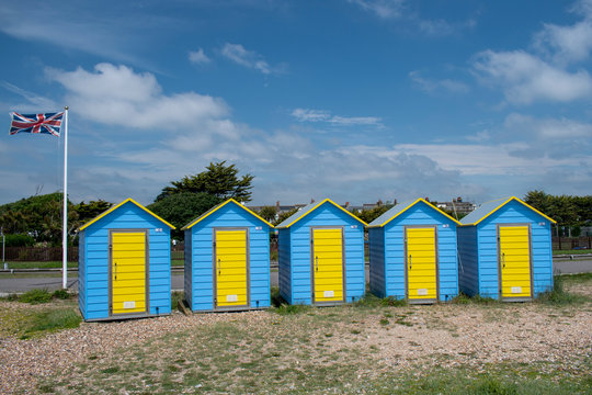 Beach huts on Littlehampton Seafront on a summer's day.