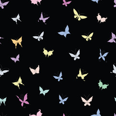 Seamless background of silhouettes of various decorative butterflies