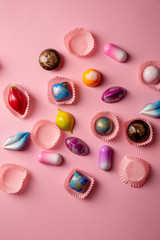 Sweet luxury chocolate bonbons from above on pink