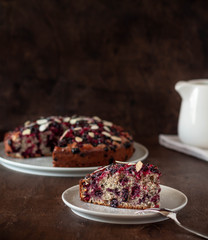 piece of cake with berries on a dark background