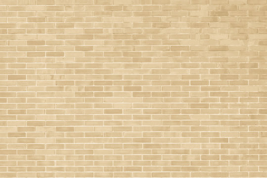 Brick wall texture pattern background in natural light ancient cream beige yellow brown