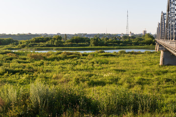 Panorama of the city. River, bridge, sunrise. Nature.