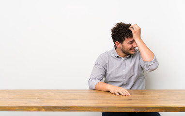 Young man with a table has realized something and intending the solution