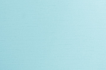 Blue silk fabric wallpaper satin texture pattern background in light pale green teal color 