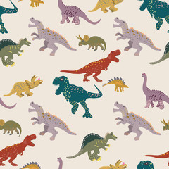 Coloured dinosaurs seamless pattern on light pink background