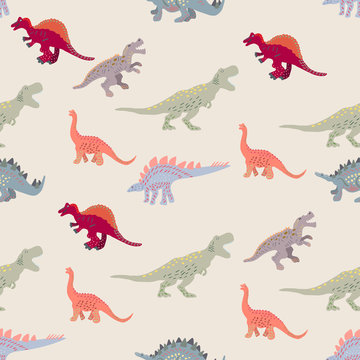 Coloured dinosaurs seamless pattern on light beige background © Nata_Prando
