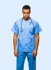 Surgeon doctor man with sad and depressed expression on isolated background