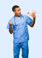 Surgeon doctor man taking a lot of money on isolated background