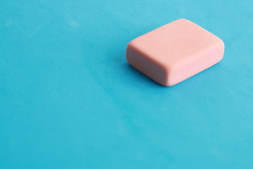 pink eraser on colorful background