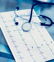 stethoscope and electrocardiogram on the table from the therapi