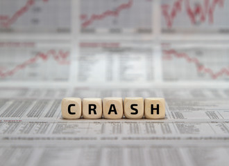 stock market crash word on a business newspaper background