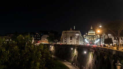 Fototapeta na wymiar walls of the Tiber river and the Basilica of San Pietro. Rome