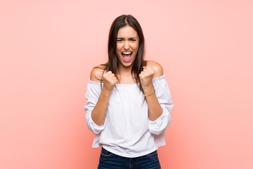 Young woman over isolated pink background frustrated by a bad situation