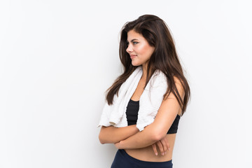 Fototapeta premium Teenager sport girl over isolated white background standing and looking to the side