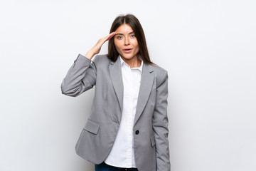 Young business woman over isolated white background has just realized something and has intending the solution