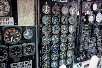 old vintage aircraft cockpit detail, pattern of multi meter gauge measure background