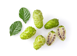 Noni fruit with leaf on white background. top view