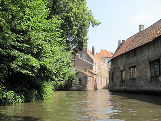 Fototapeta na wymiar Scenery with water canal in Bruges, Belgium.