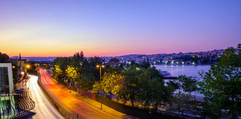 Traffic lights in Istanbul at sunset. Evening view of the Golden Horn in Balat