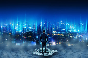 Fototapeta na wymiar Business man standing on future network city