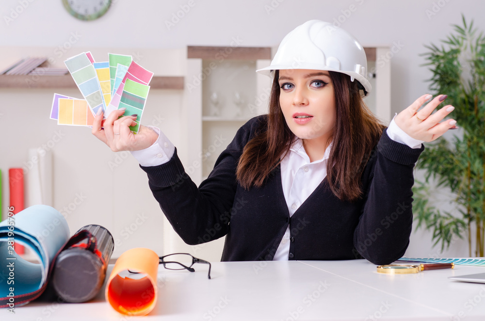 Wall mural female designer working in the office