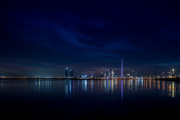 Fototapeta premium Dubai Skyline City Lights & Reflections in Water, Dubai, United Arab Emirates