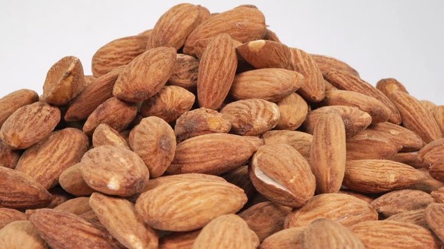 A Pile Of Goodness is a stunning and cinematic stock video of a mountain load of roasted almonds.