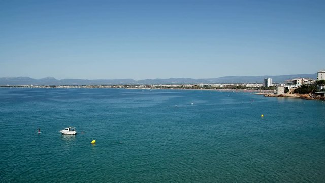  Time lapse in the sea of Salou, Spain. Busy coastline and beach at summer
