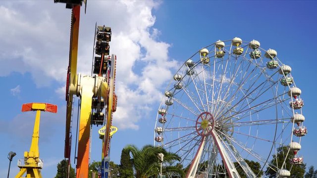 Ferris Wheel Close Up  is a stock video that shows fine footage of a wheel ride on closeup. The booths are moving well and the scene is set in a vivid sky.