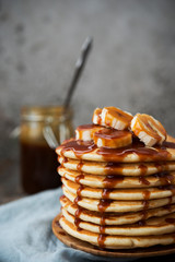 American  pancakes with banana and  caramel. Vertical orientation