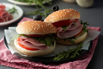 Hamburger with ham. Two burgers, hoemmade food. healthy sandwich with fresh vegetables.