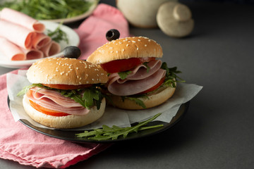 Hamburger with ham. Two burgers, hoemmade food. healthy sandwich with fresh vegetables.
