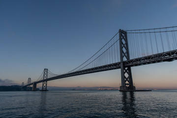 Fototapeta na wymiar Majestic Bay Bridge vista in San Francisco at dusk, Northern California