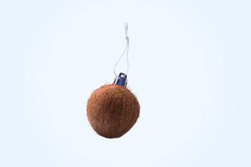 Christmas toy from coconut over blue background. Christmas toy concept for decorating the Christmas tree