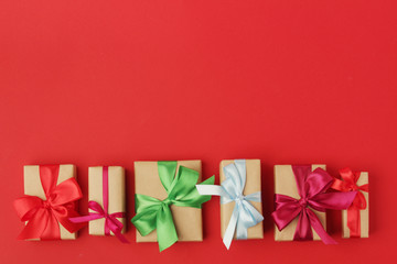 Gifts packed with craft paper and colorful satin ribbons	