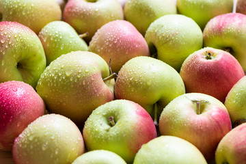 Selective focus. Drops of water on ripe apples.