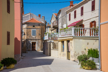 Fototapeta na wymiar Narrow stone street. Croatia, summer 2018.