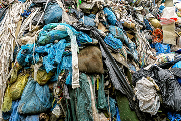 garbage dump with plastic garbage bags