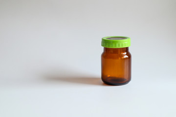 Brown Chicken Soup Extract Bottle, Green Lid on White Background,mockup