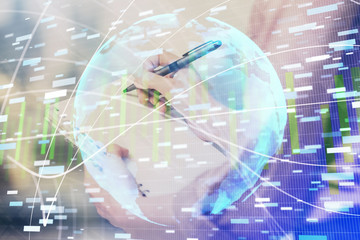 International business hologram over hands taking notes background. Concept of success. Multi exposure