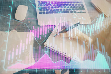 Financial graph displayed on woman's hand taking notes background. Concept of research. Multi exposure