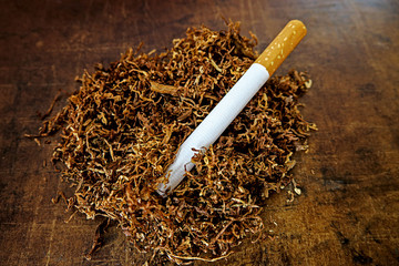 Tobacco and empty cigarette tube to stuff itself