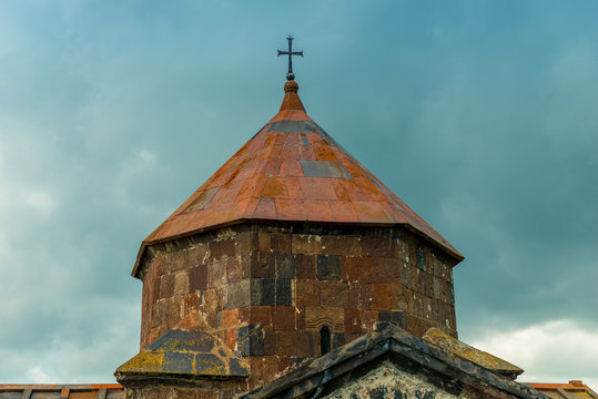 Closeup of the dome of the Sevanavank Monastery on Lake Sevan in Armenia against the background of blue clouds