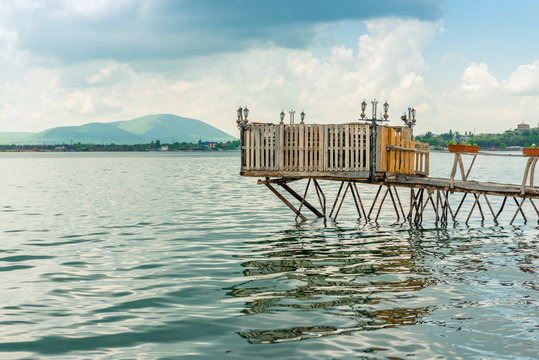 Authentic wooden pier on Lake Sevan, Armenian landscape