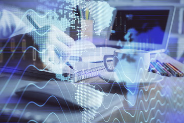 Financial chart drawn over hands taking notes background. Concept of research. Double exposure