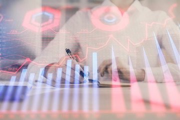 Financial chart drawn over hands taking notes background. Concept of research. Multi exposure