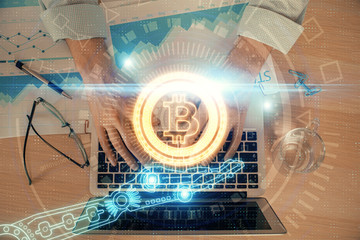 Blockchain theme hud with man working on computer on background. Concept of crypto chain. Double exposure.