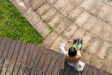 Asian woman using smart watch and mobile